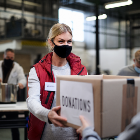 Woman accepting box of donations